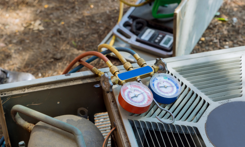 HVAC gauges and supplies on top of a generator.